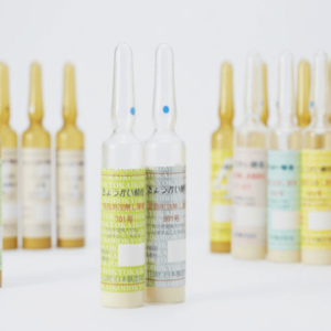 Colorful ampules of sake yeast on a white backdrop.